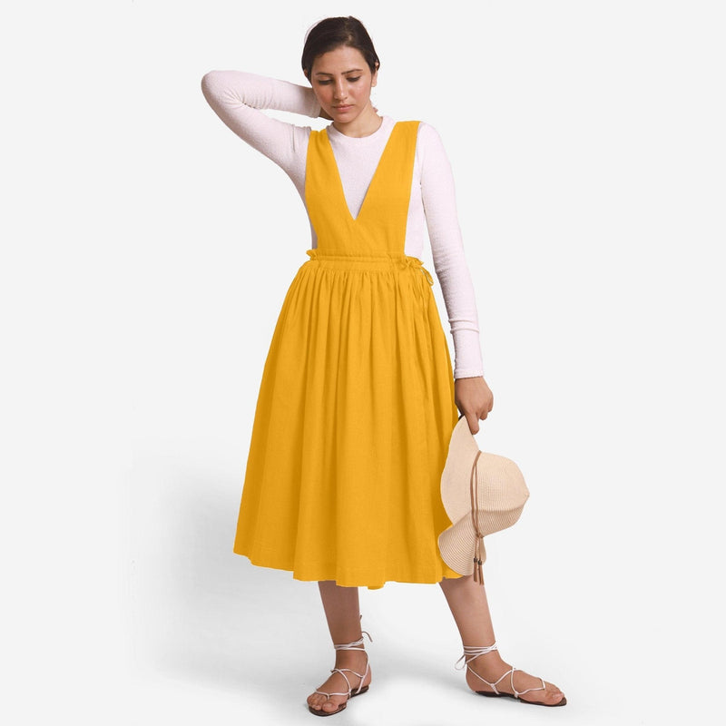 Front View of a Model wearing Yellow Deep Neck Pinafore Midi Wrap Dress