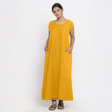 Front View of a Model wearing Yellow Cotton Flax A-Line Paneled Dress