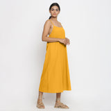 Right View of a Model wearing Yellow Cotton Flax Strap Sleeve A-Line Dress