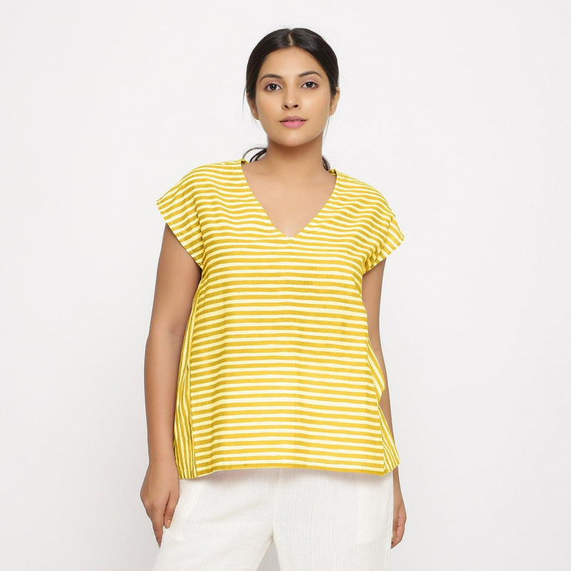 Front View of a Model wearing Yellow Hand Screen Printed 100% Cotton Top