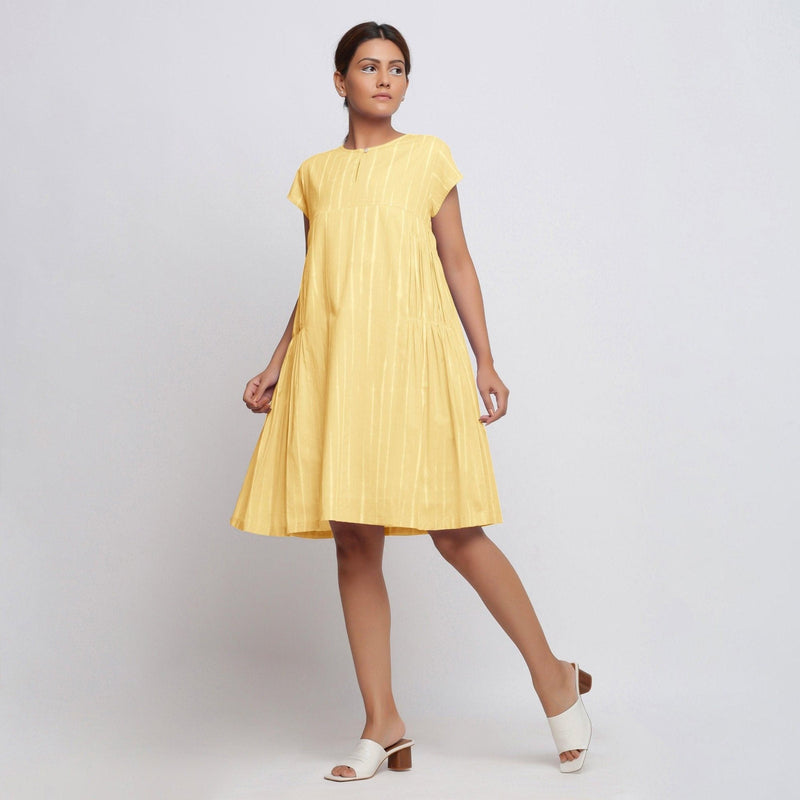 Front View of a Model wearing Yellow Tie Dye Yoked Knee Length Dress