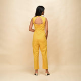 Back View of a Model wearing Yellow Handspun Cotton Princess Line Sleeveless Jumpsuit