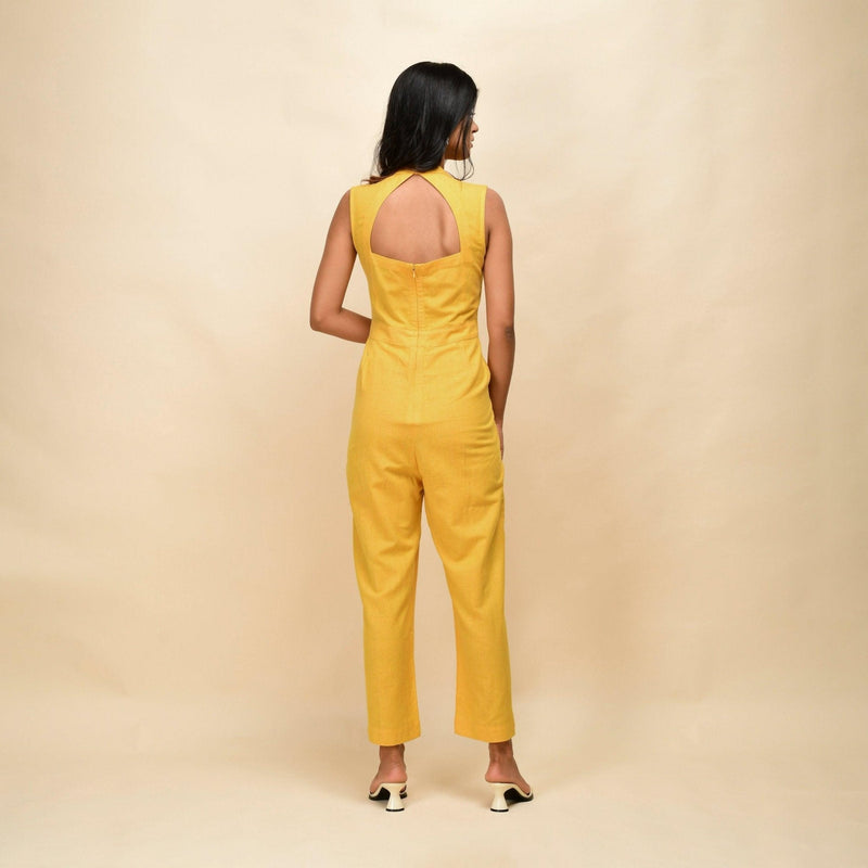 Back View of a Model wearing Yellow Handspun Cotton Princess Line Sleeveless Jumpsuit