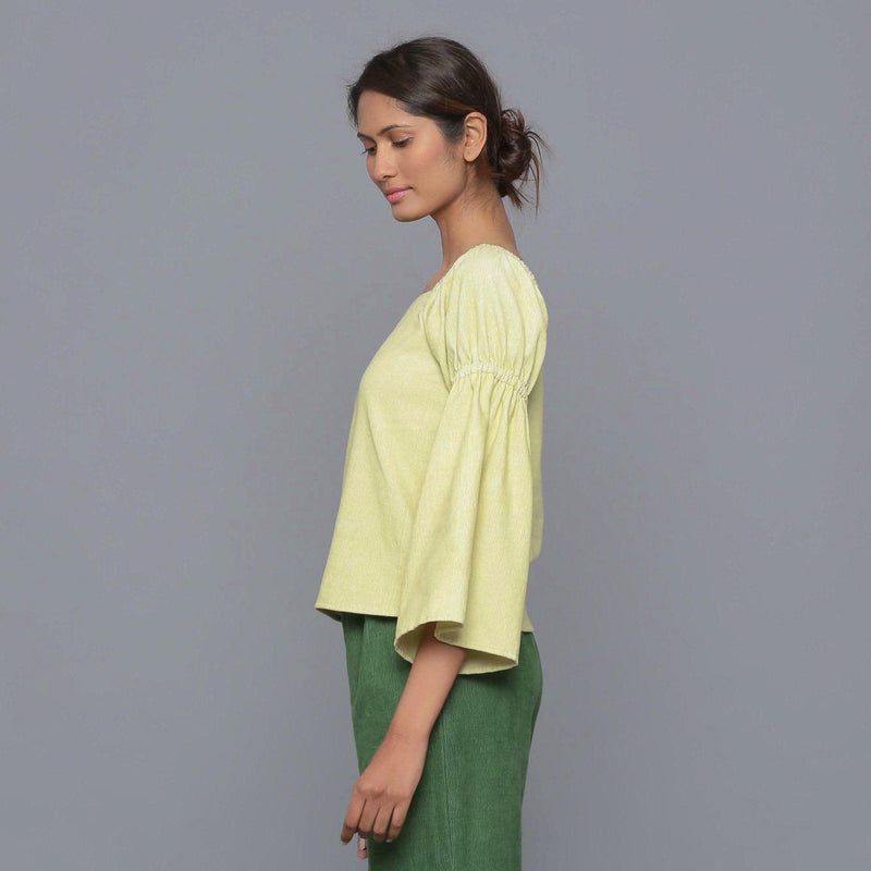 Left View of a Model wearing Yellow Pistachio Corduroy Bohemian Top