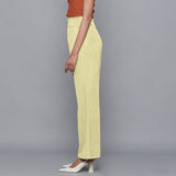 Left View of a Model wearing Yellow Pistachio Corduroy Striped Bootcut Pant