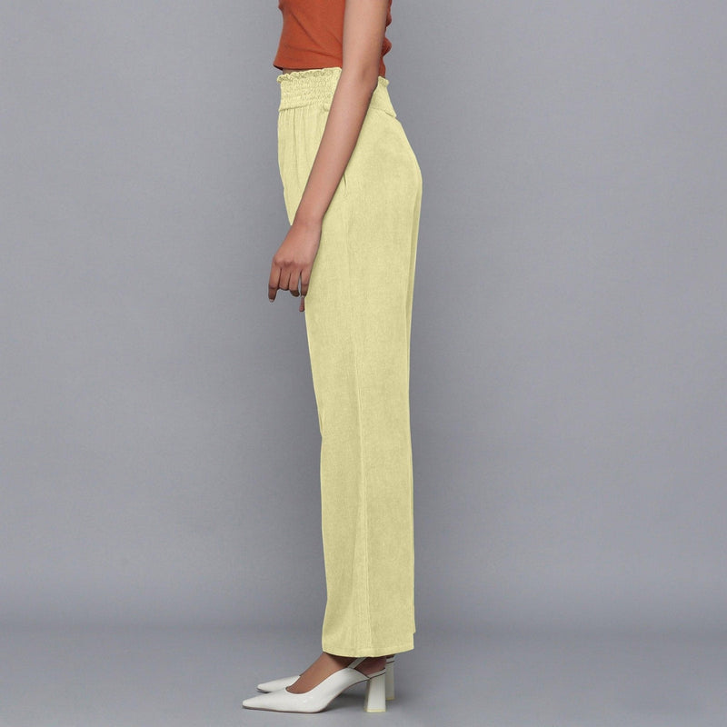 Left View of a Model wearing Yellow Pistachio Corduroy Striped Bootcut Pant