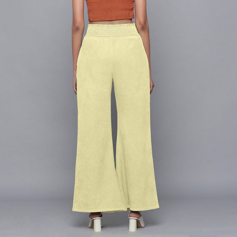 Back View of a Model wearing Yellow Pistachio Corduroy Striped Bootcut Pant