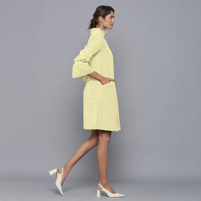 Right View of a Model wearing Yellow Pistachio Corduroy High Neck Dress