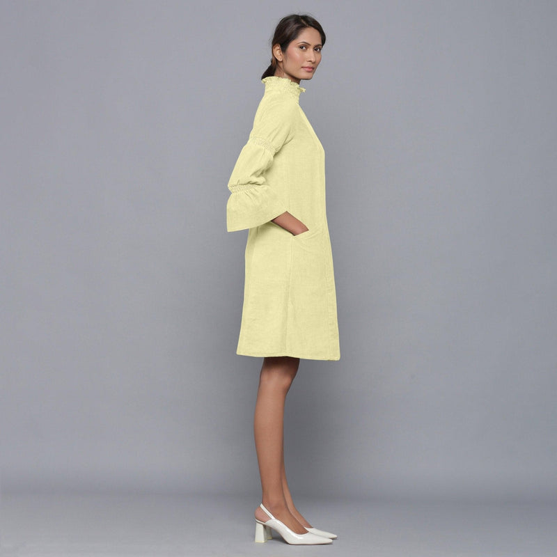 Right View of a Model wearing Yellow Pistachio Corduroy High Neck Dress