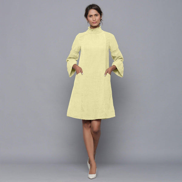 Front View of a Model wearing Yellow Pistachio Corduroy High Neck Dress