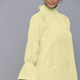 Front Detail of a Model wearing Yellow Pistachio Corduroy High Neck Dress