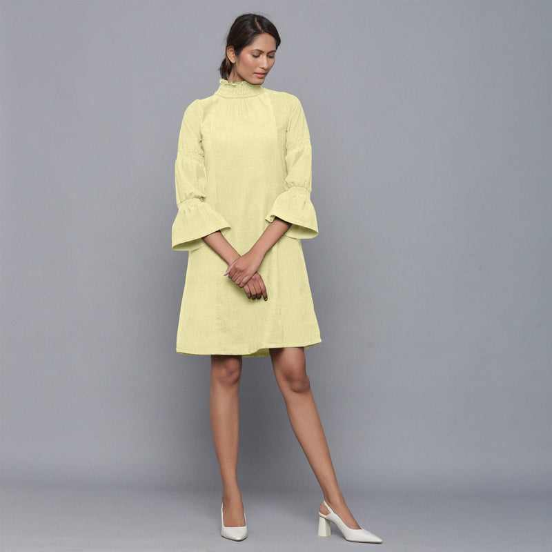 Front View of a Model wearing Yellow Pistachio Corduroy High Neck Dress