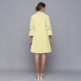 Back View of a Model wearing Yellow Pistachio Corduroy High Neck Dress