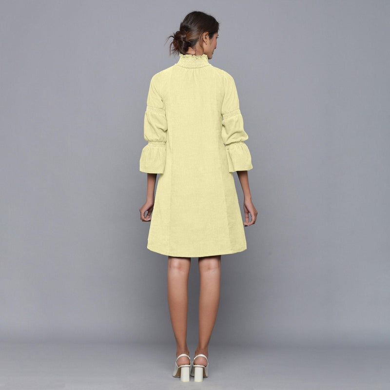 Back View of a Model wearing Yellow Pistachio Corduroy High Neck Dress