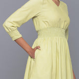 Right Detail of a Model wearing Yellow Pistachio V-Neck Corduroy Dress