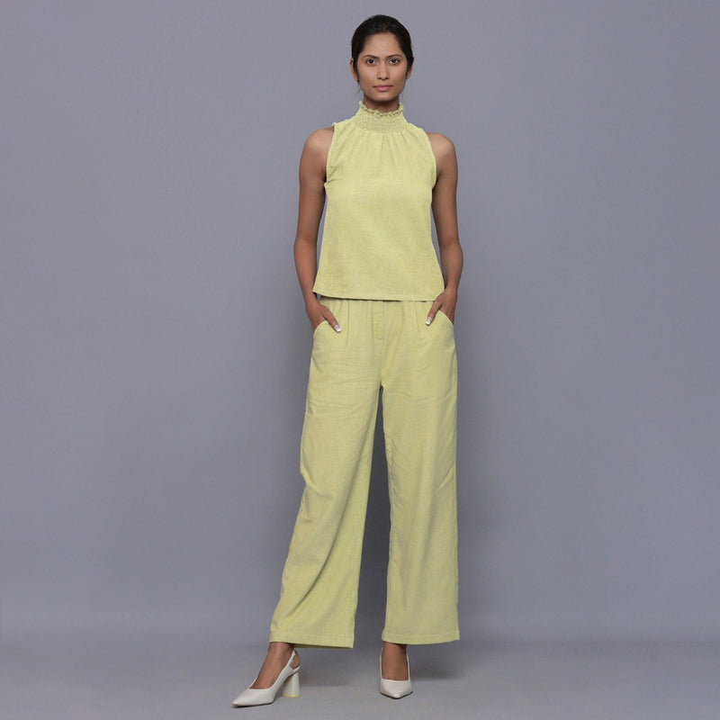 Front View of a Model wearing Yellow Pistachio Cotton Corduroy High Neck Top