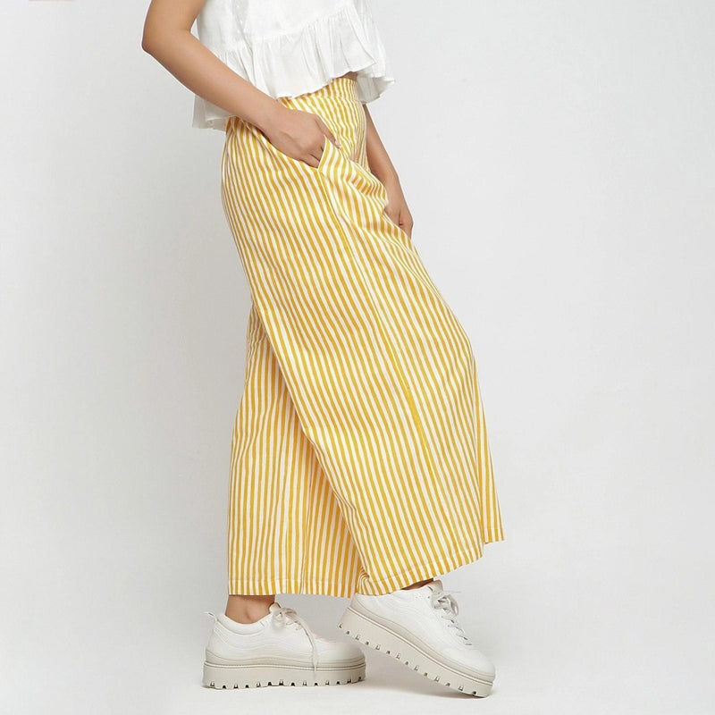 Right View of a Model wearing Yellow Striped Wide Legged Cotton Pant