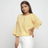 Front View of a Model wearing Yellow Hand Screen Printed Straight Top