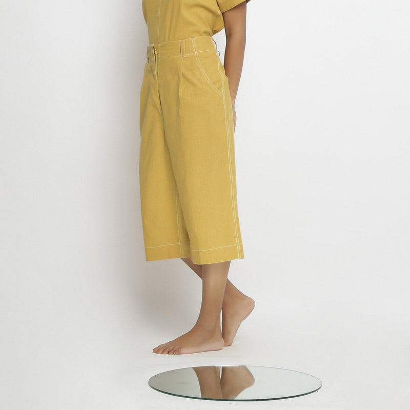 Left View of a Model wearing Yellow Mid Rise Vegetable Dyed Culottes