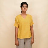 Front View of a Model wearing Yellow 100% Cotton Half-Sleeve Top