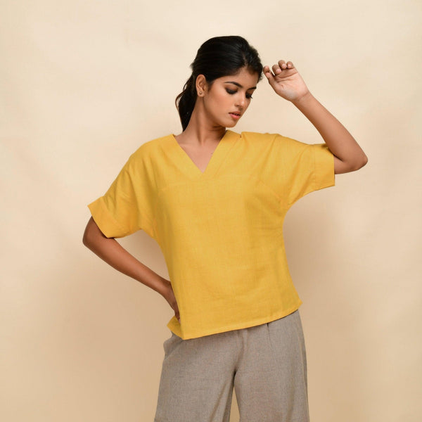 Front View of a Model wearing Yellow 100% Cotton Half-Sleeve Top