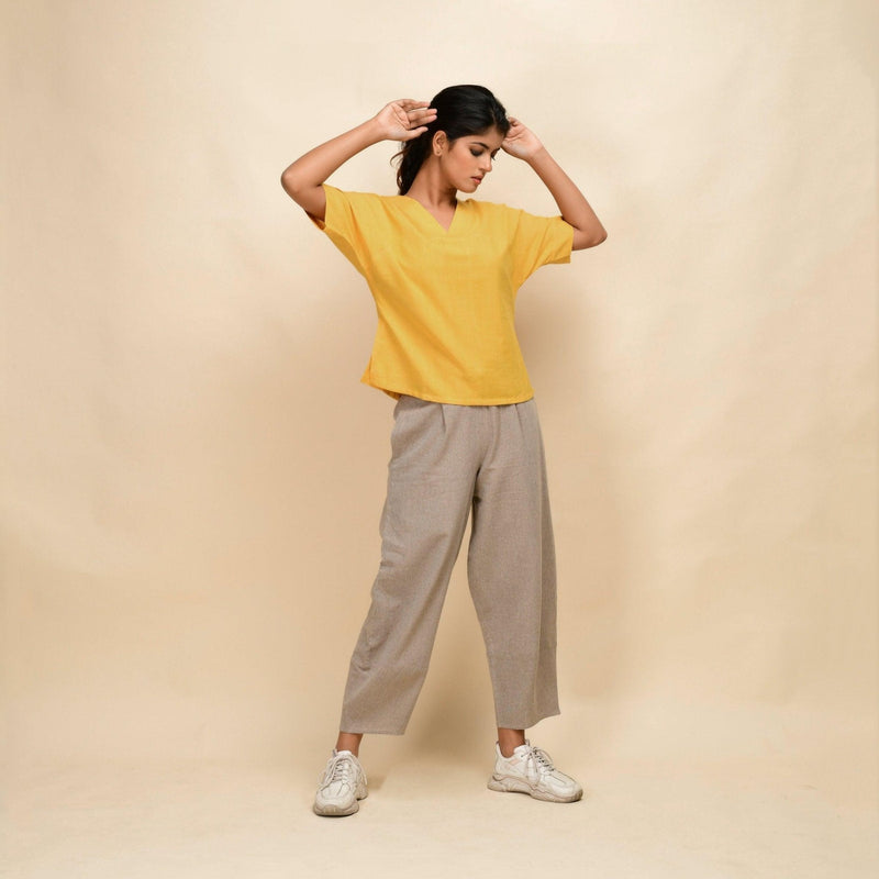 Right View of a Model wearing Yellow 100% Cotton Half-Sleeve Top