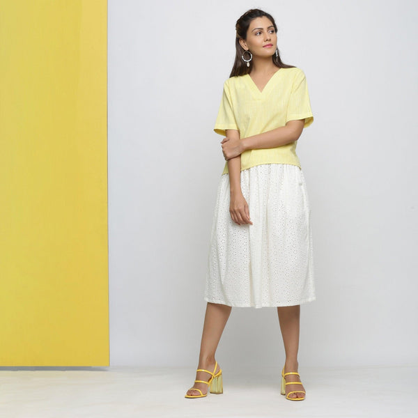 Front View of a Model wearing Yellow Yarn Dyed Cotton High Low Top