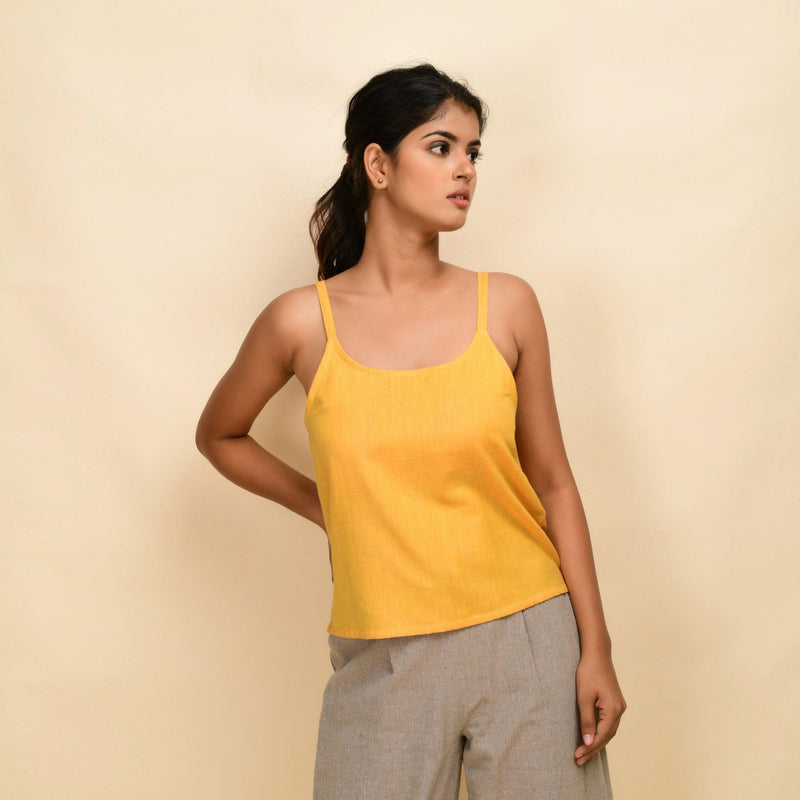 Front View of a Model wearing Yellow Yarn Dyed Handspun Cotton Round Neck Spaghetti Top