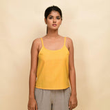 Front View of a Model wearing Yellow Yarn Dyed Handspun Cotton Round Neck Spaghetti Top