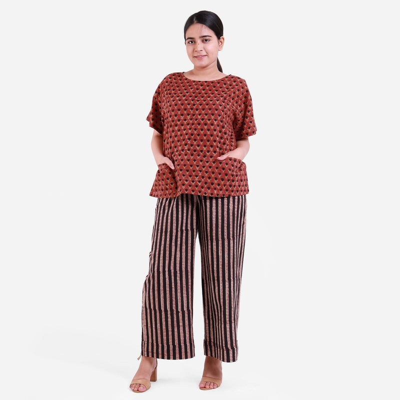 Front View of a Model wearing Block Printed Bagru Top and Striped Pant Set