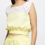 Front Detail of a Model wearing Yellow Cotton Lace Hand-Embroidered Crop Top