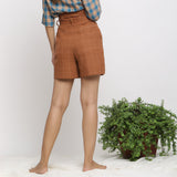Back View of a Model wearing Almond Brown Handspun Paperbag Shorts