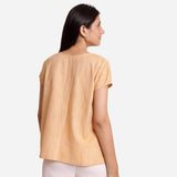 Back View of a Model wearing Light Yellow Boat-Neck Anti-Cling Top