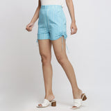Left View of a Model wearing Aqua Blue Tie-Dye Cotton Elasticated Short Shorts