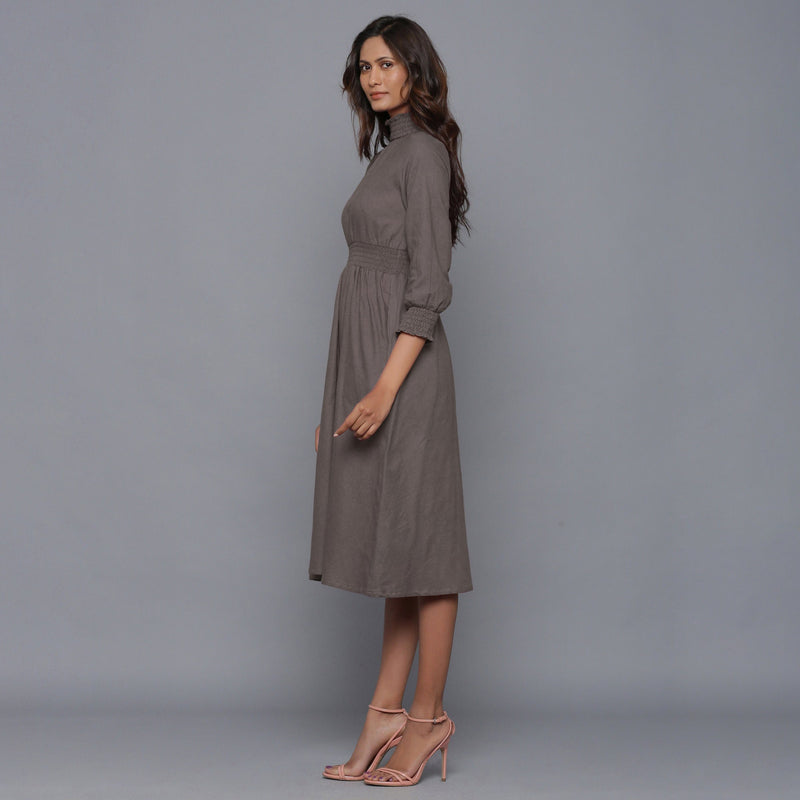 Left View of a Model wearing Ash Grey Flannel High Neck Midi Dress