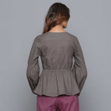 Back View of a Model wearing Ash Grey V-Neck Flannel Peplum Top