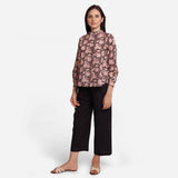 Front View of a Model wearing Asymmetric Floral Shirt and Black Pant Set