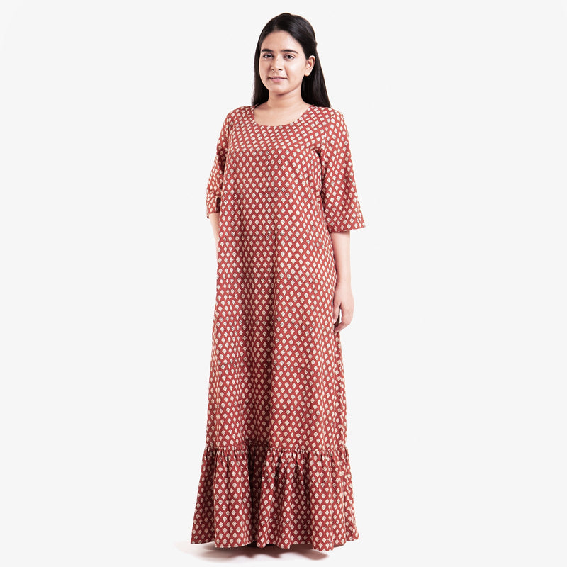 Front View of a Model wearing Brick Red Block Printed Cotton Floor Length Bohemian Dress