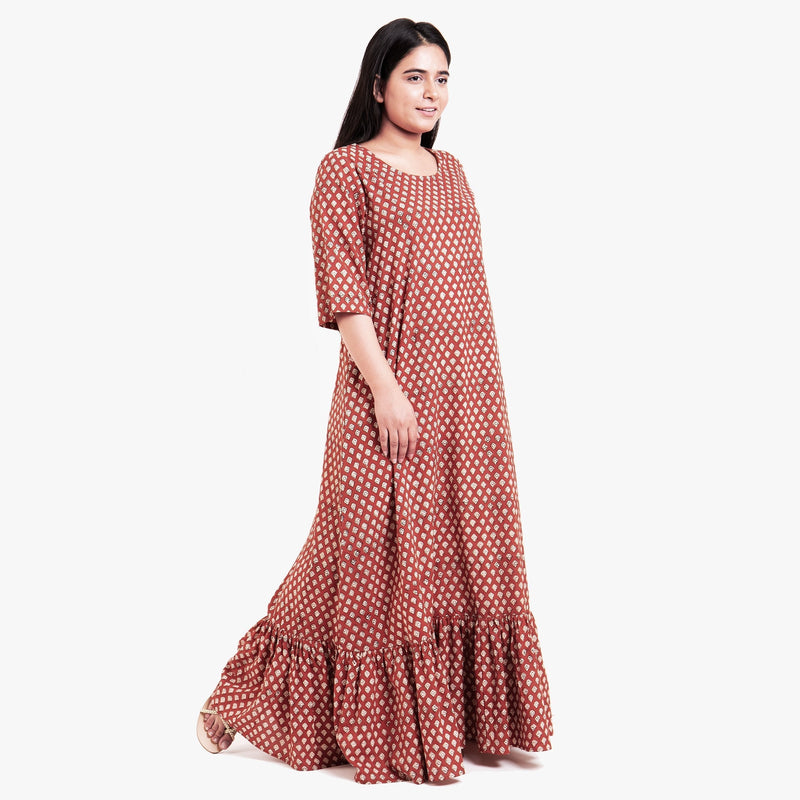 Right View of a Model wearing Brick Red Block Printed Cotton Floor Length Bohemian Dress
