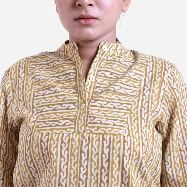 Front Detail of a Model wearing Mustard Striped Block Print Cotton Mandarin Collar Top