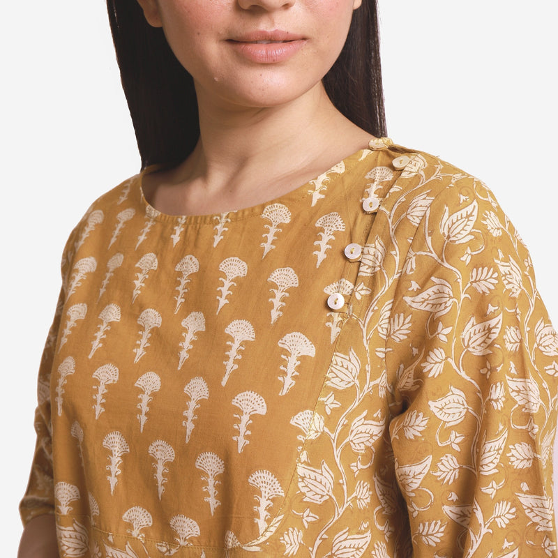 Front Detail of a Model wearing Mustard Block Printed Cotton Midi Yoke Dress
