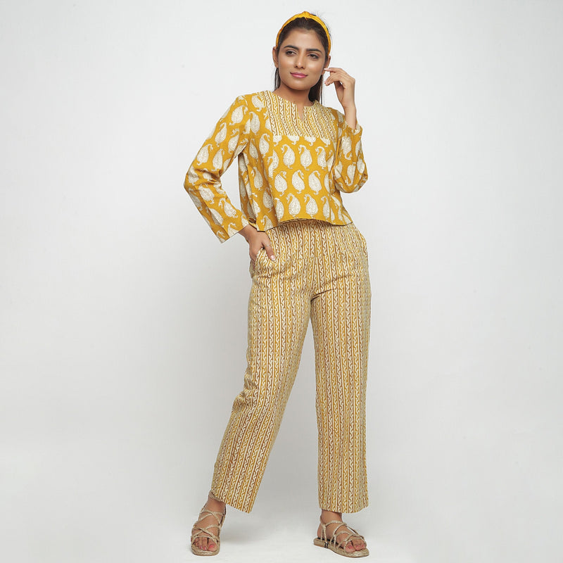 Front View of a Model wearing Mustard Bagru Block Printed High-Low Cotton Top