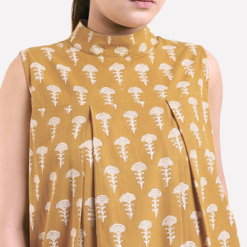 Front Detail of a Model wearing Mustard Bagru Block Print Pleated Cotton Midi Dress
