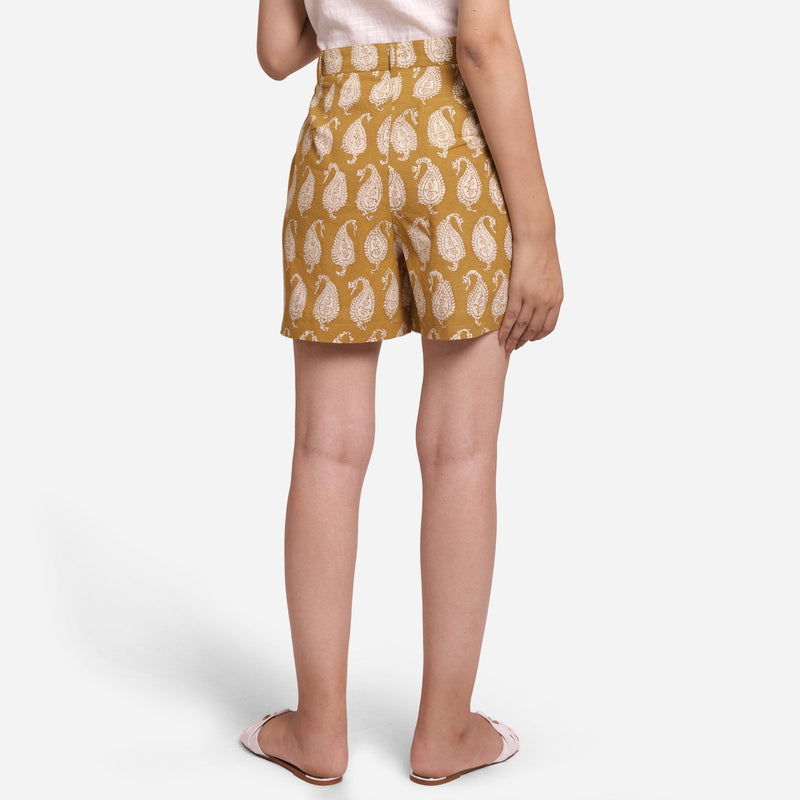 Back View of a Model wearing Mustard Paisley Block Print Cotton Shorts