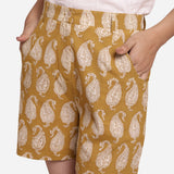 Front Detail of a Model wearing Mustard Paisley Block Print Cotton Shorts