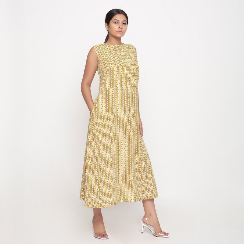 Right View of a Model wearing Mustard Block Print Cotton Shift Maxi Dress