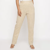 Front View of a Model wearing Beige Yarn Dyed Mid Rise Tapered Pant