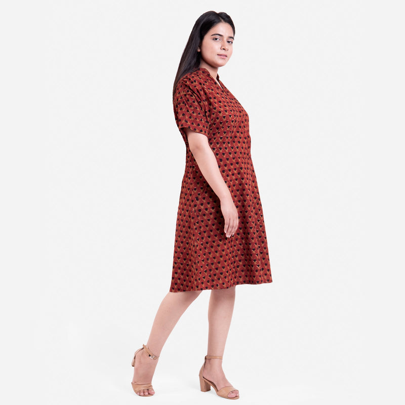Right View of a Model wearing Red Floral Block Printed Cotton Knee Length Shirt Dress