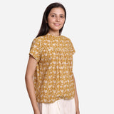 Right View of a Model wearing Mustard Bagru Print Relaxed Fit Top
