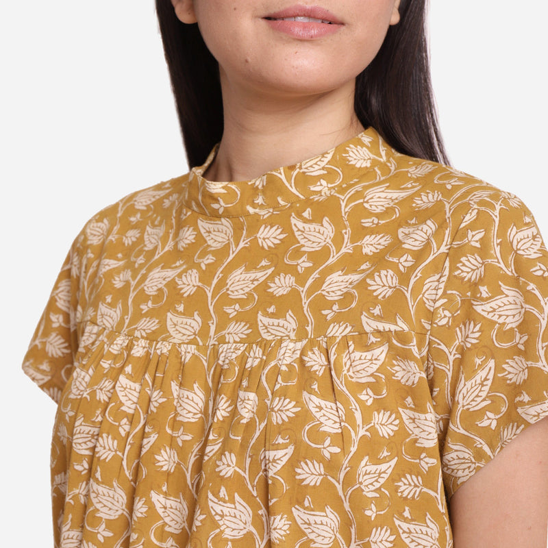 Front Detail of a Model wearing Mustard Bagru Print Relaxed Fit Top